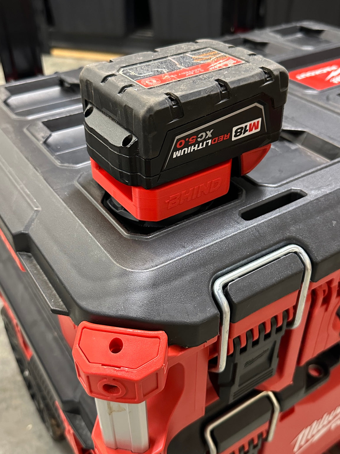 BHIND M18 Battery Mount with a Milwaukee M18 battery on a compatible PACKOUT surface