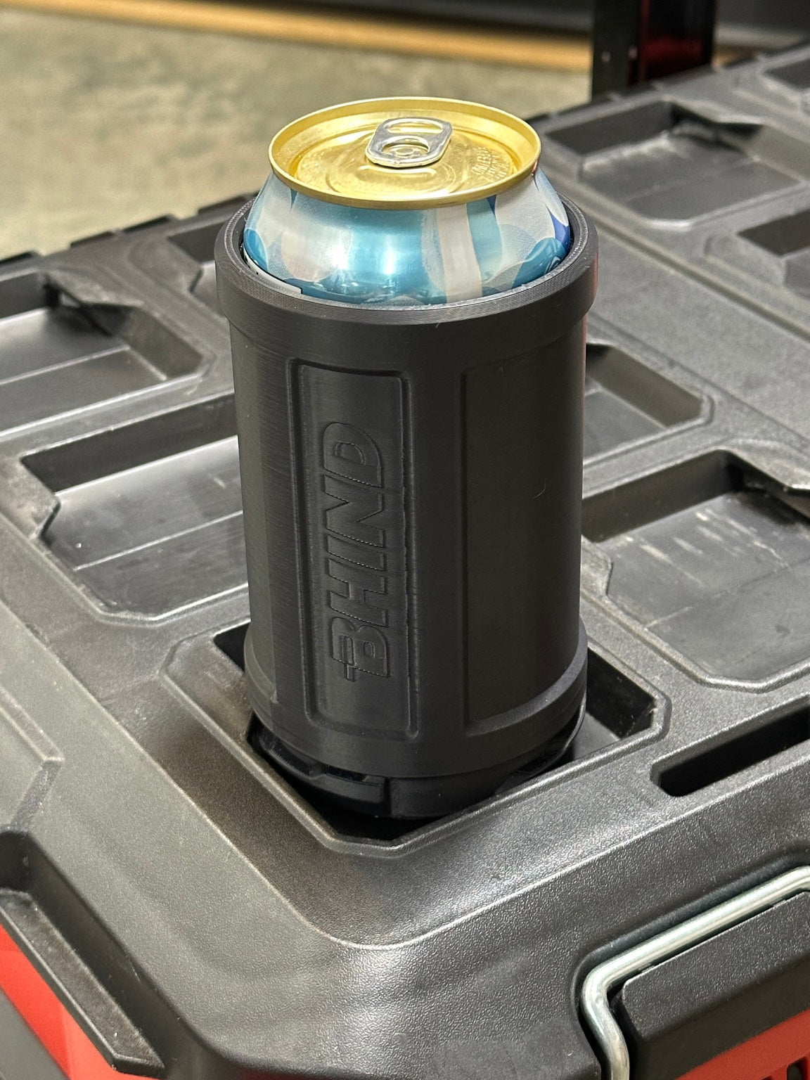 BHIND Can Holder with integrated HUB mounted on a compatible PACKOUT surface