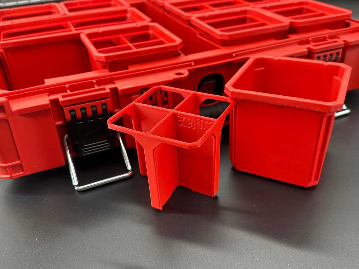 Close-up of red BHIND SB4 divider beside an original Milwaukee PACKOUT small bin